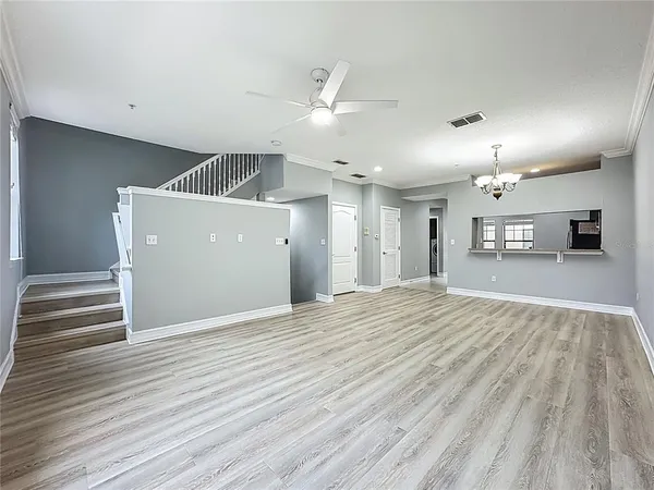 a view of a kitchen with a sink and a refrigerator