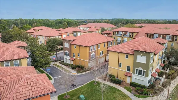 an aerial view of residential houses and outdoor space