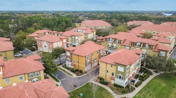 an aerial view of an outdoor space swimming pool and mountains