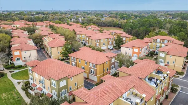 an aerial view of residential houses and outdoor space