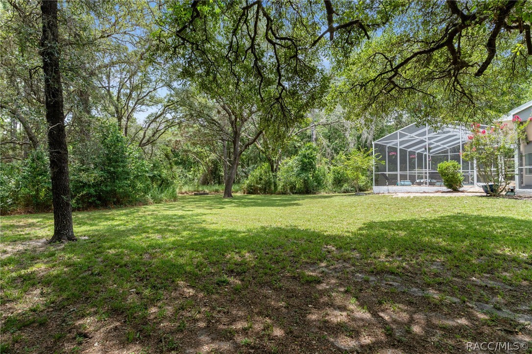 2460 West Pine Ridge Boulevard Beverly Hills, FL 34465 - Photo 41 of 47 a view of outdoor space with deck and yard