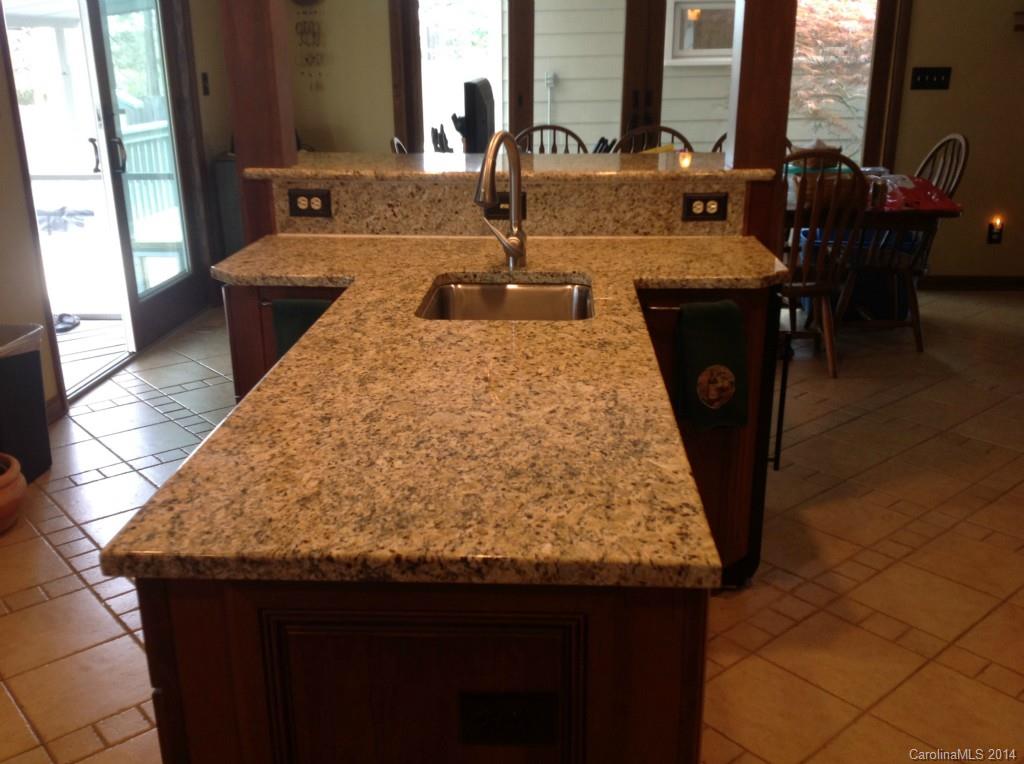 4421 Rounding Run Road Charlotte, NC 28277 - Photo 7 of 17 a kitchen with kitchen island granite countertop a sink and a granite counter tops