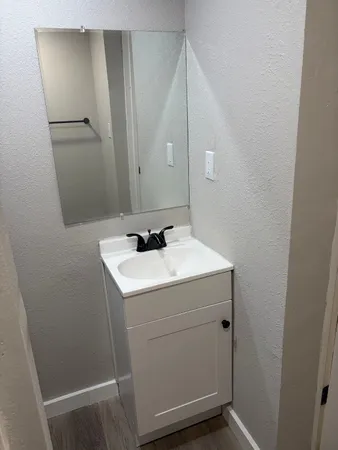 a bathroom with a sink and mirror