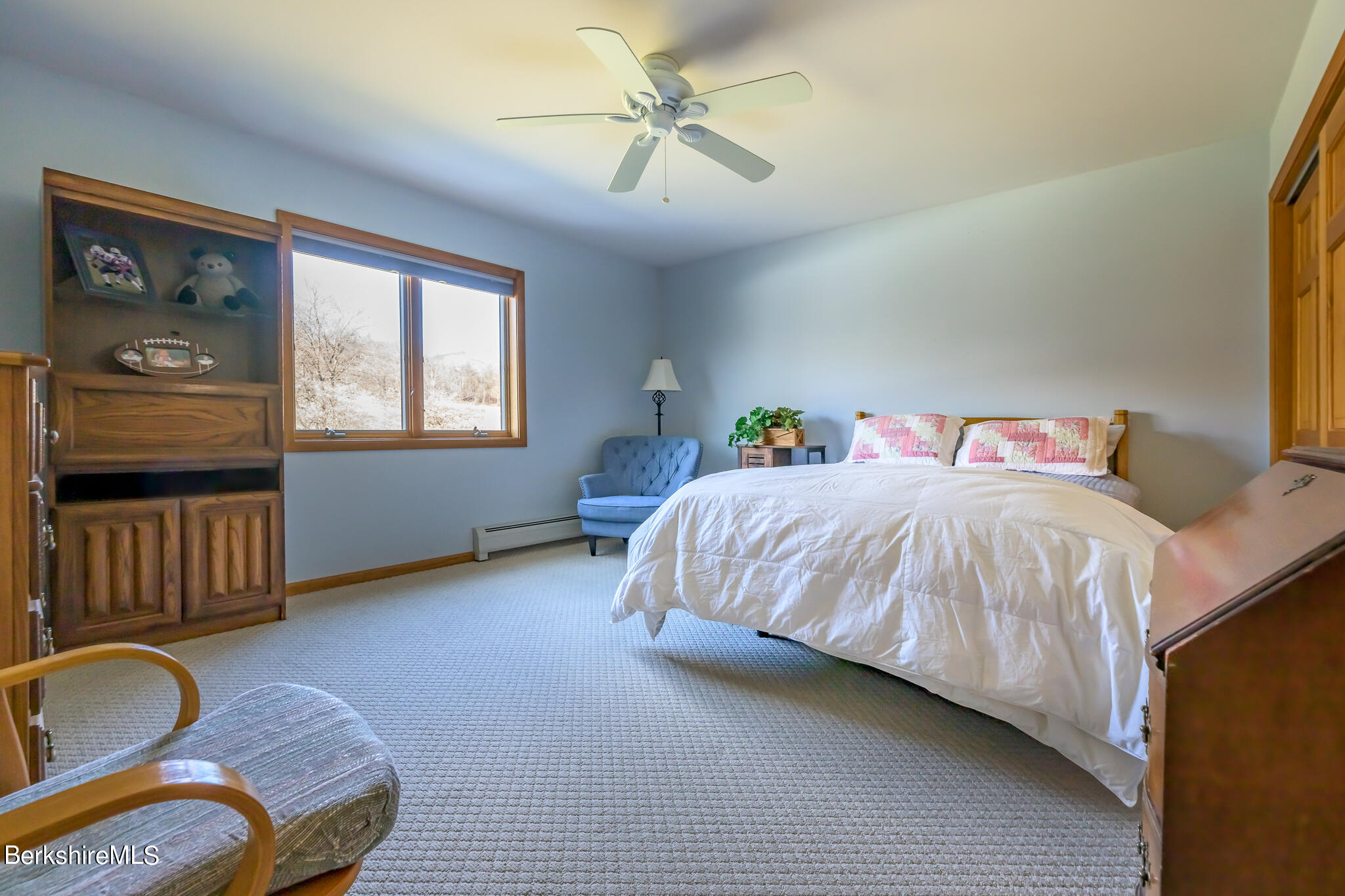 18 East Road Adams, MA 01220 - Photo 17 of 43 a bedroom with a bed and a chandelier