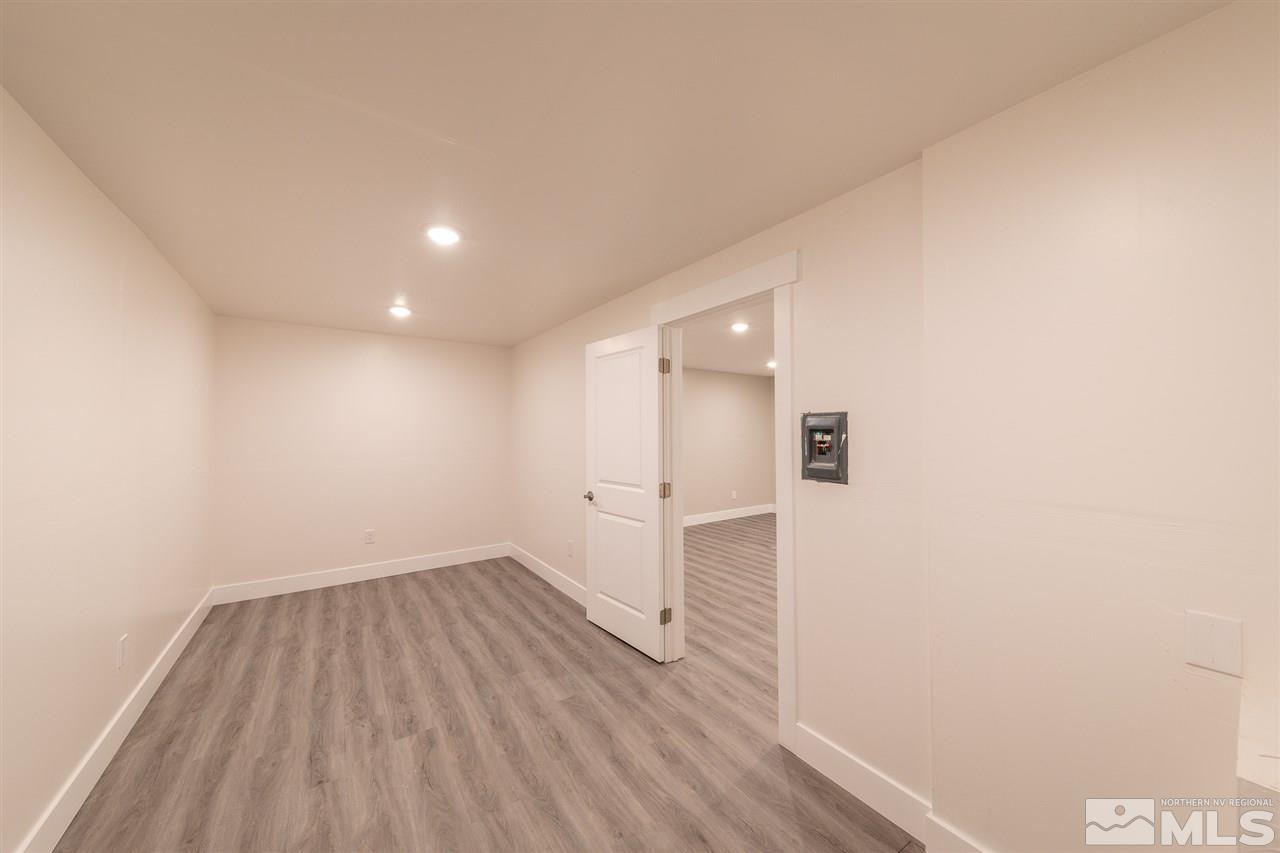 1070 Foothill Road Reno, NV 89511 - Photo 14 of 17 a view of a hallway with wooden floor