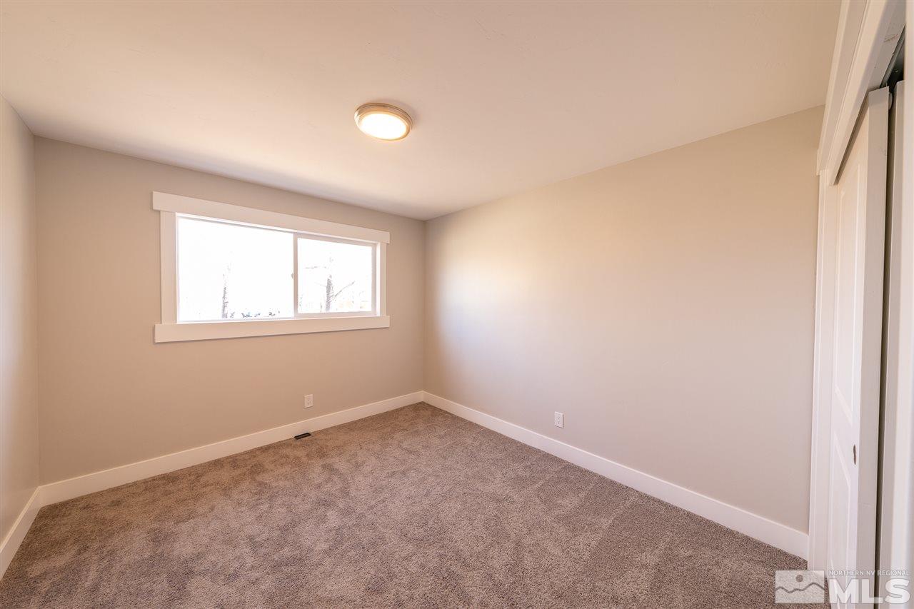 1070 Foothill Road Reno, NV 89511 - Photo 6 of 17 an empty room with windows