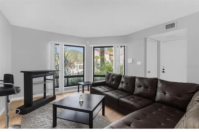 a living room with furniture and a window