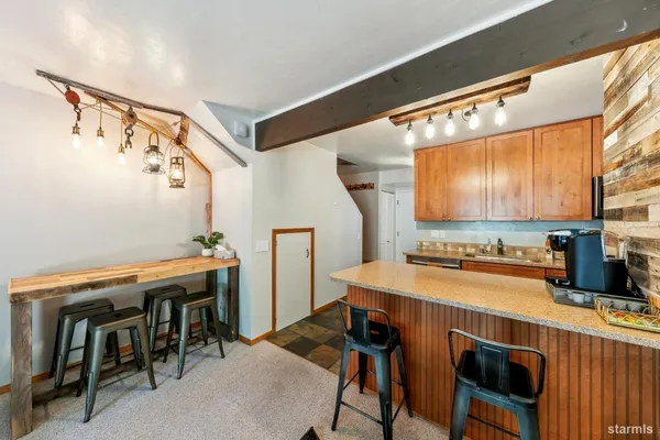 a view of a dining room with furniture and a window
