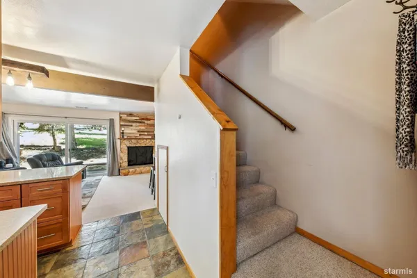 a view of entryway and kitchen