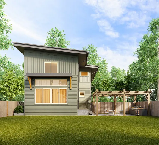 a front view of a house with a yard table and chairs