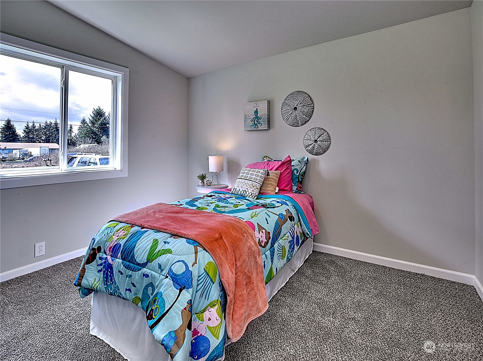7230 196th Avenue Southwest Rochester, WA 98579 - Photo 27 of 39 a bedroom with a bed and a window