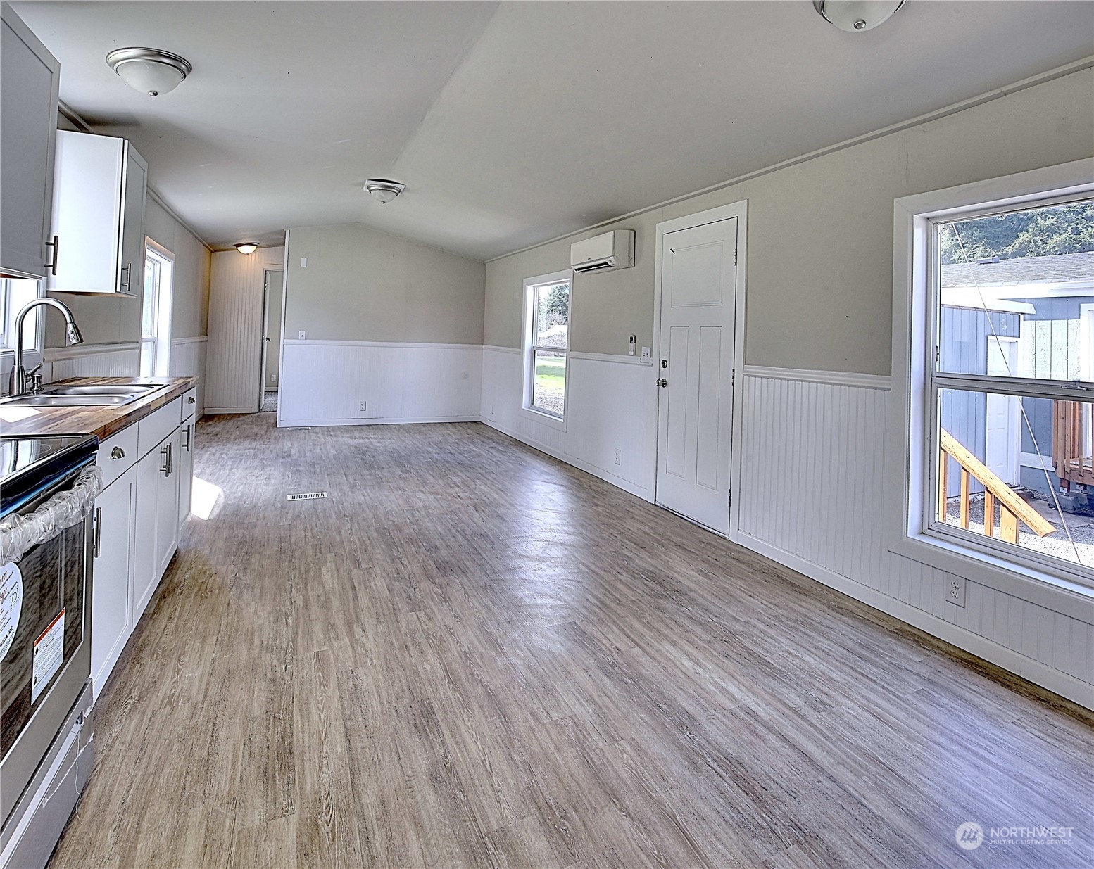 7230 196th Avenue Southwest Rochester, WA 98579 - Photo 33 of 39 a view of a kitchen cabinets a stove and wooden floor