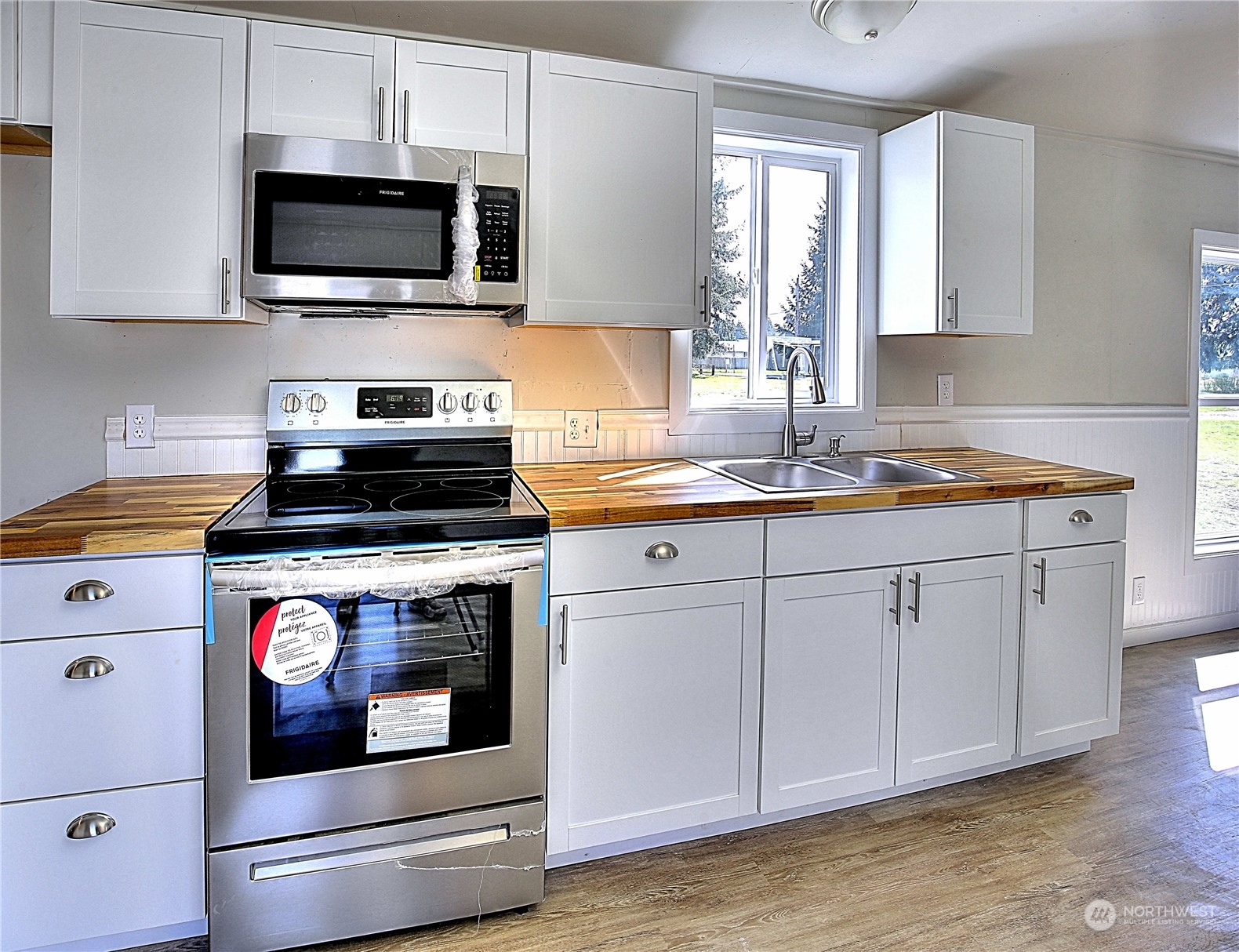7230 196th Avenue Southwest Rochester, WA 98579 - Photo 36 of 39 a kitchen with cabinets appliances and a sink
