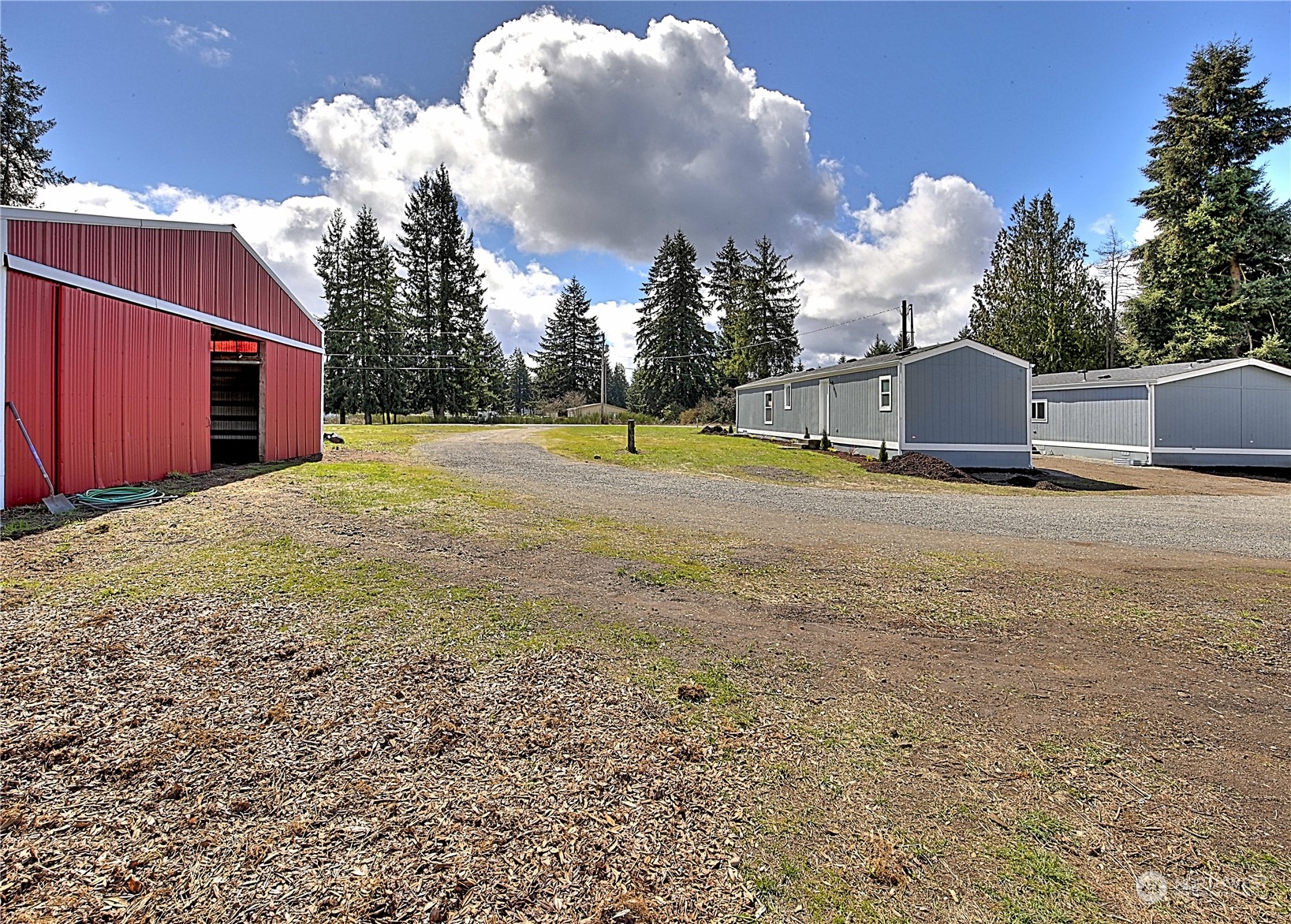 7230 196th Avenue Southwest Rochester, WA 98579 - Photo 8 of 39 a view of a backyard of a house