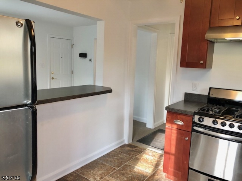 830 Bluestone Lane Bridgewater, NJ 08807 - Photo 11 of 29 a kitchen with a stove and a refrigerator