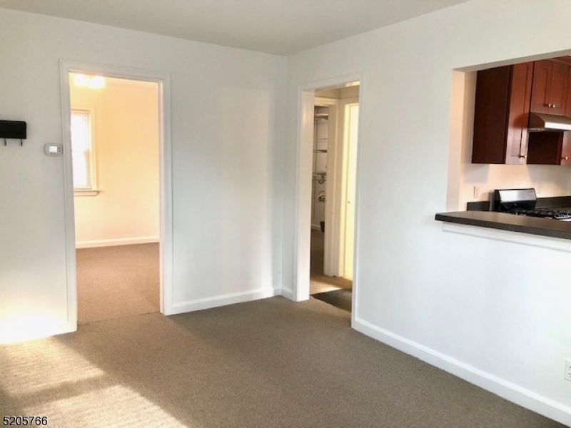 830 Bluestone Lane Bridgewater, NJ 08807 - Photo 7 of 29 a view of a room with a flat tv screen and a door