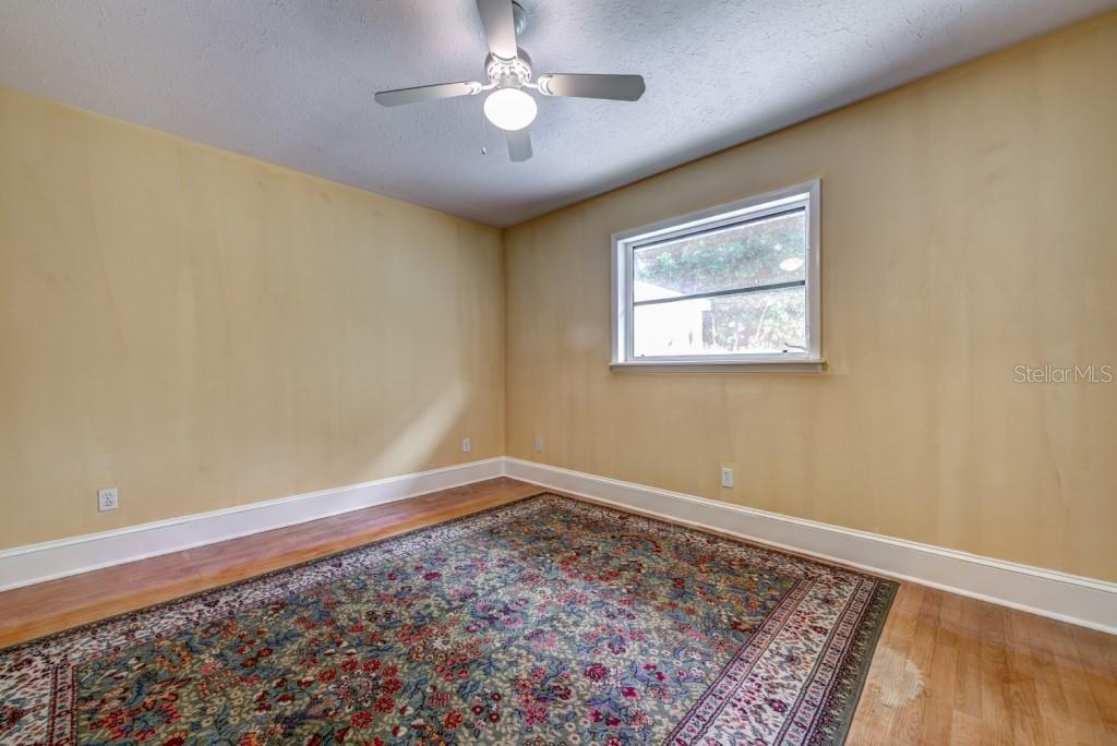 1453 Nantucket Road Venice, FL 34293 - Photo 21 of 35 The spacious 13x11 guest bedroom has laminate floors and overlooks the rear yard.