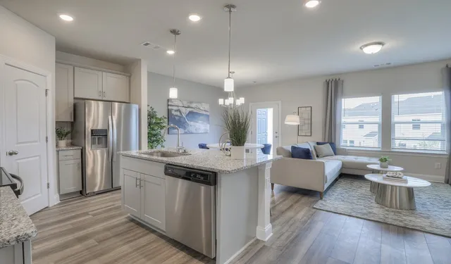 a view of kitchen with sink and wooden floor