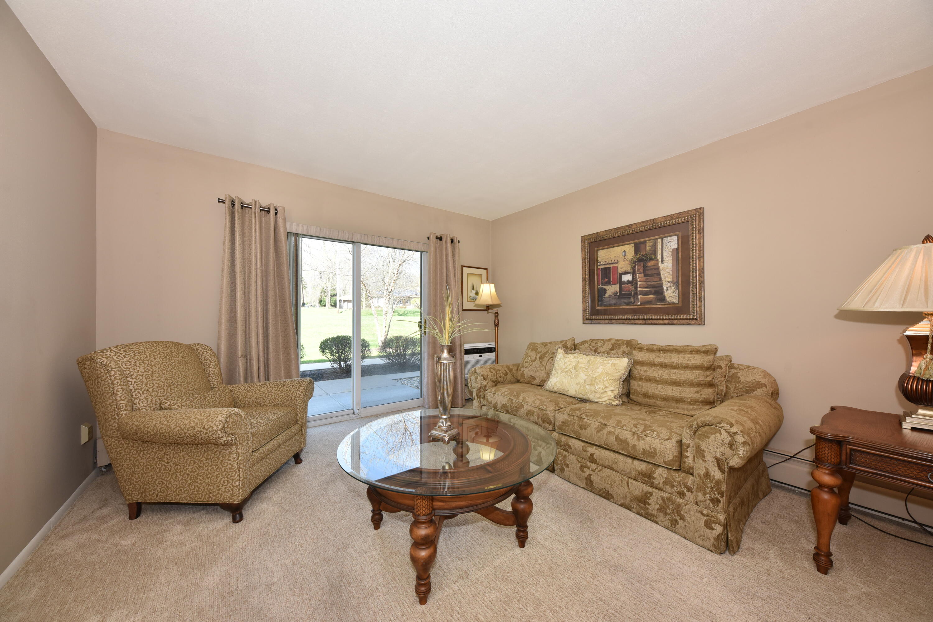 3935 South 84th Street, Unit 4 Greenfield, WI 53228 - Photo 2 of 24 Living Room with Large Patio Doors