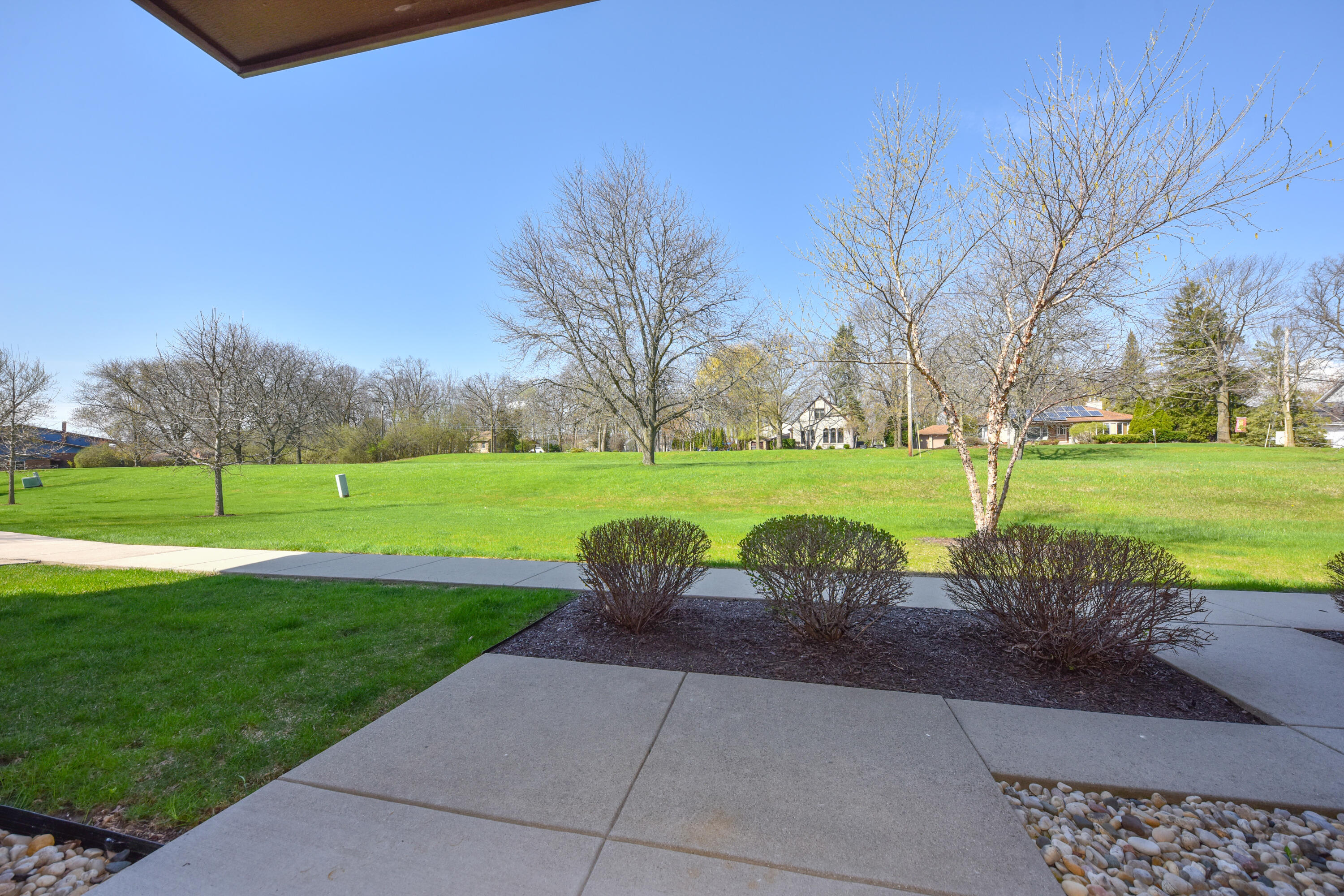 3935 South 84th Street, Unit 4 Greenfield, WI 53228 - Photo 23 of 24 Patio and Greenspace