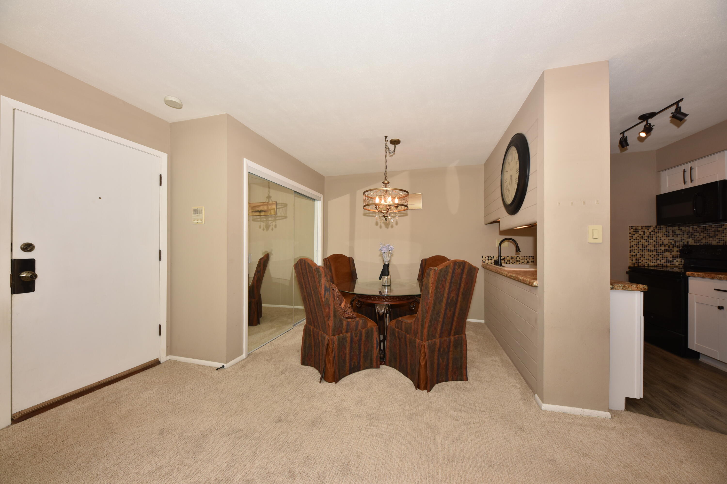 3935 South 84th Street, Unit 4 Greenfield, WI 53228 - Photo 3 of 24 Dining Area Has Open Counter to Kitchen