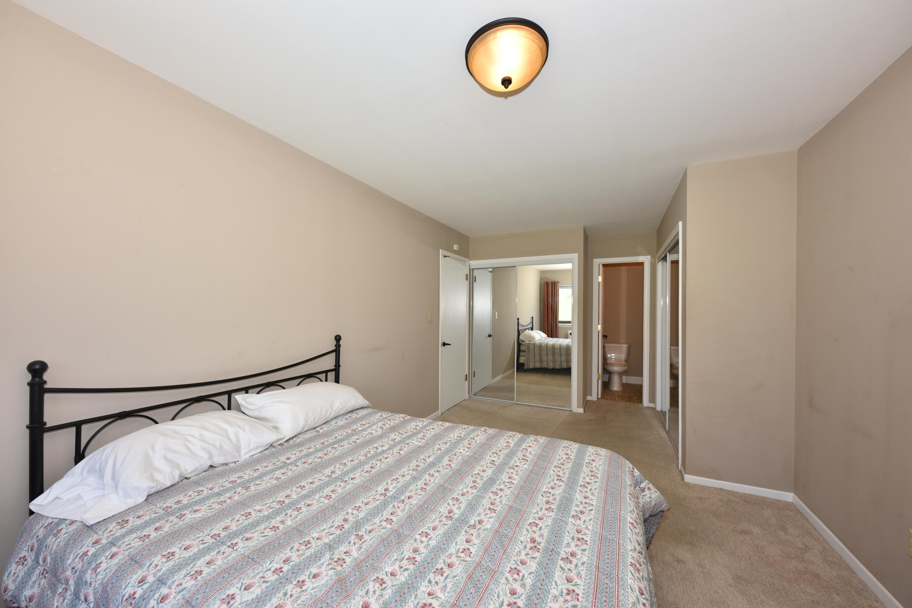 3935 South 84th Street, Unit 4 Greenfield, WI 53228 - Photo 10 of 24 Large Master bedroom with 2 closets