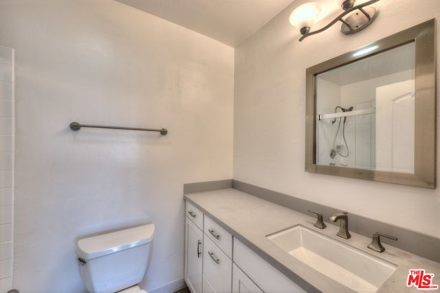 a view of a city with tall trees