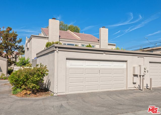 a view of a backyard with a garden and plants