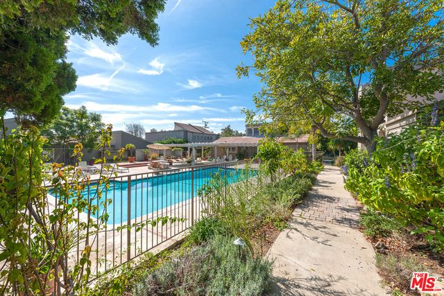 a view of a swimming pool with a patio