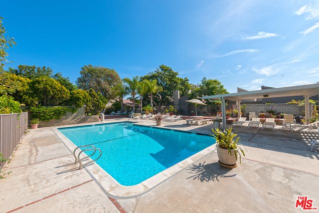 a front view of house with yard and outdoor seating