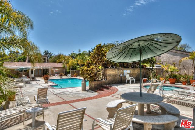 a view of a street with a building in the background