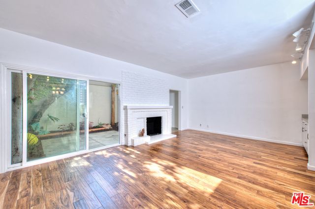 a view of backyard with tub