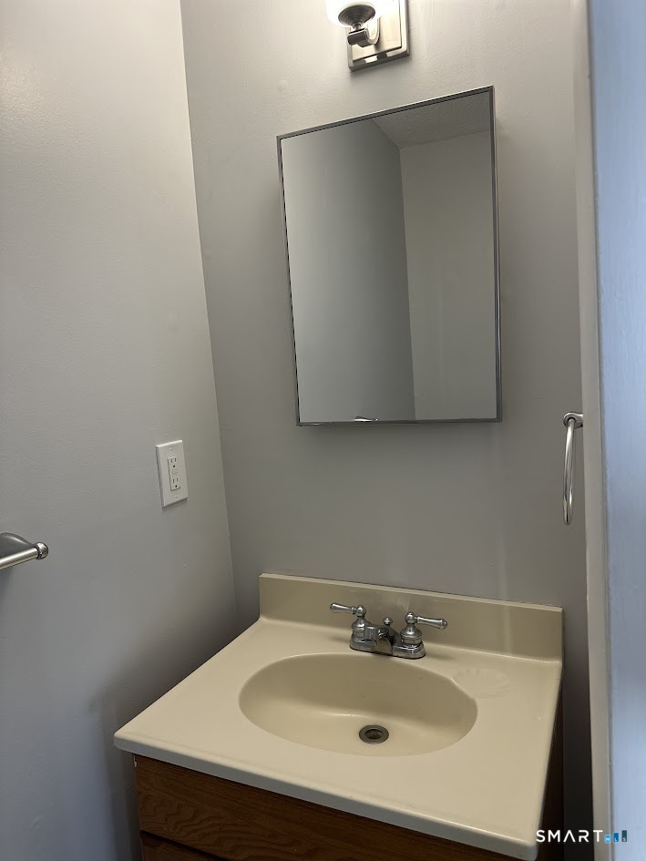 39 Horton Hill Road, Unit 7C Naugatuck, CT 06770 - Photo 13 of 29 a bathroom with a sink and mirror