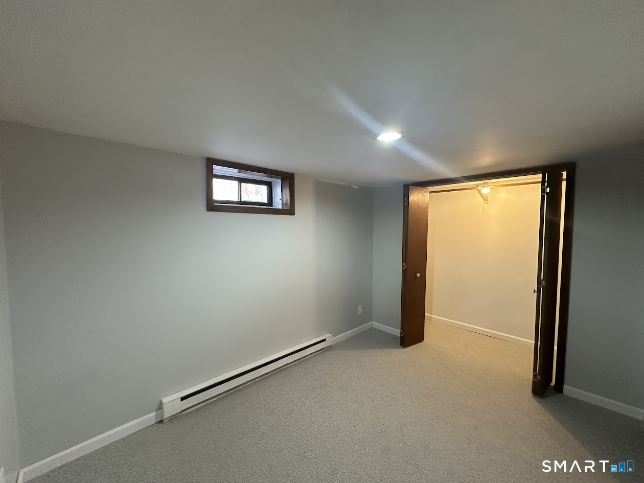 39 Horton Hill Road, Unit 7C Naugatuck, CT 06770 - Photo 22 of 29 an empty room with windows