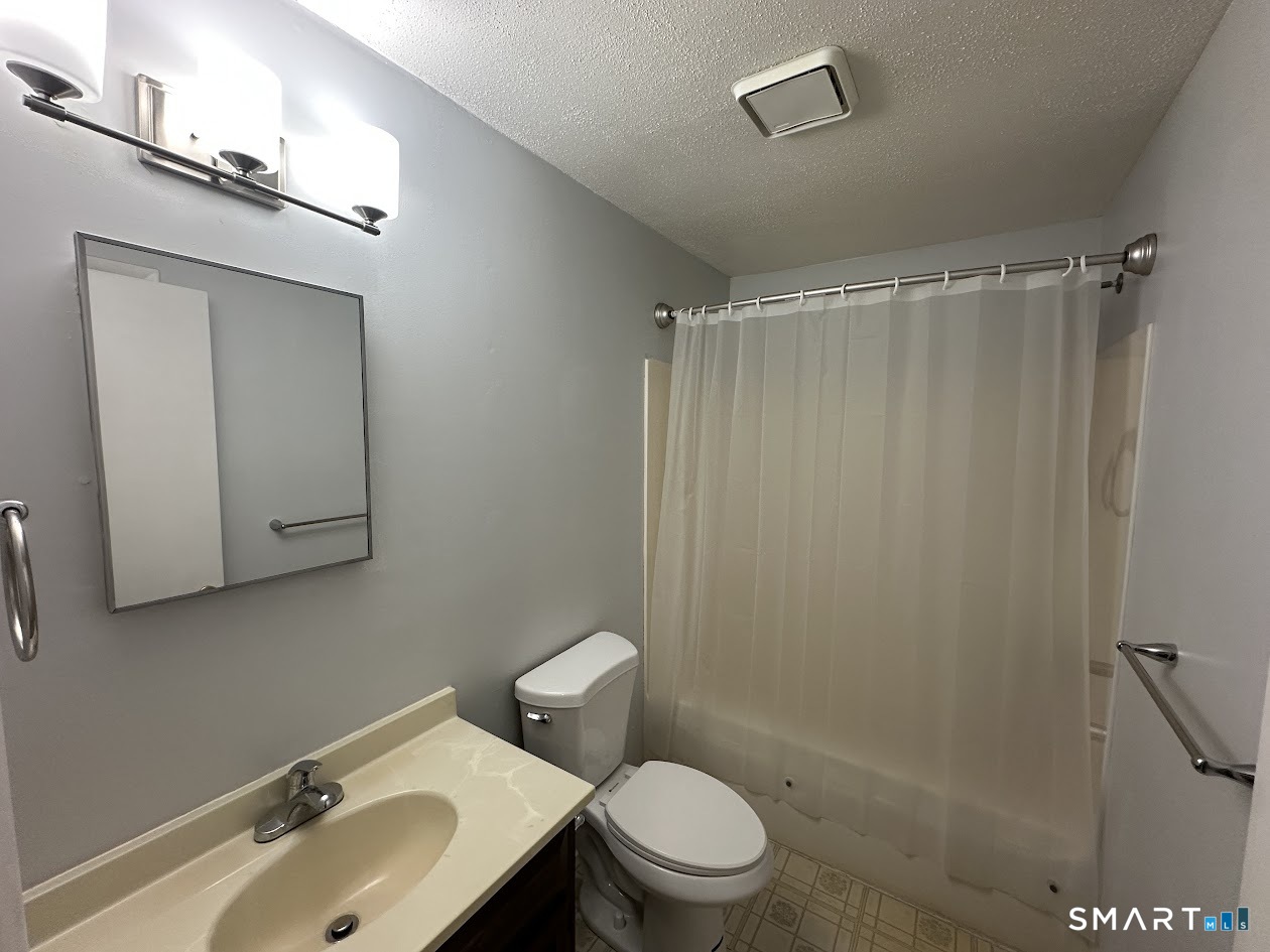 39 Horton Hill Road, Unit 7C Naugatuck, CT 06770 - Photo 25 of 29 a bathroom with a sink a toilet and shower