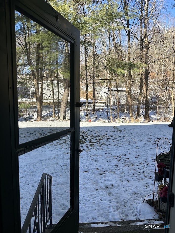 39 Horton Hill Road, Unit 7C Naugatuck, CT 06770 - Photo 27 of 29 a view of a porch with a bench in a patio