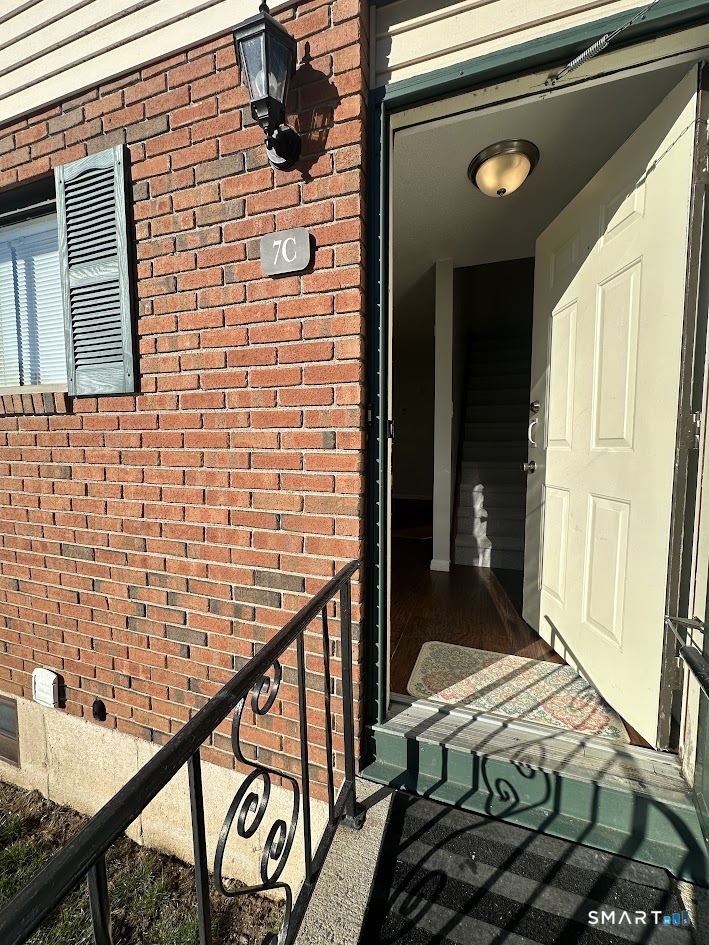 39 Horton Hill Road, Unit 7C Naugatuck, CT 06770 - Photo 4 of 29 a balcony view with couple of chairs