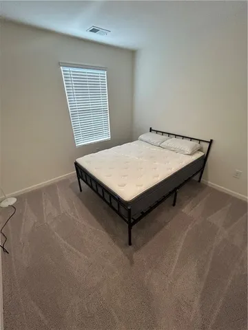 a room with a table and windows