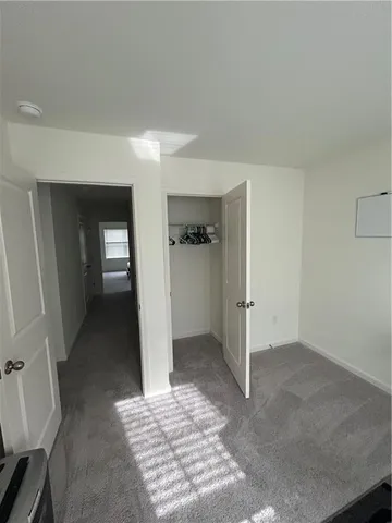 a bathroom with a double vanity sink mirror and toilet