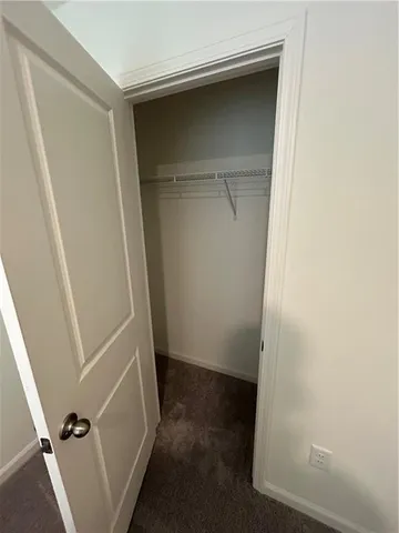 a bedroom with furniture and wooden floor