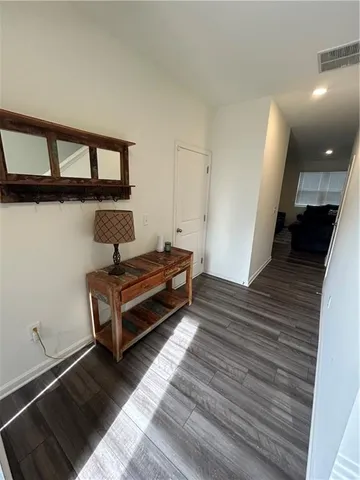 a view of a storage and utility room with washer and dryer