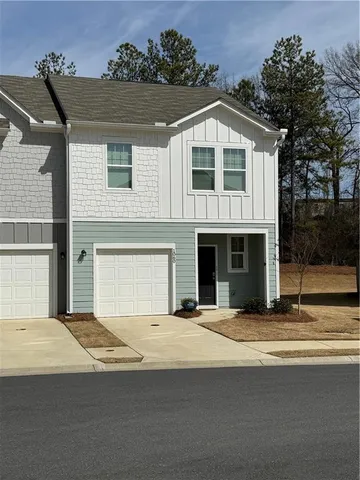 a front view of a house with yard