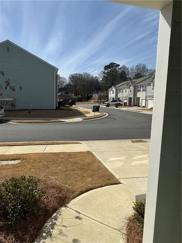 a view of building and car parked