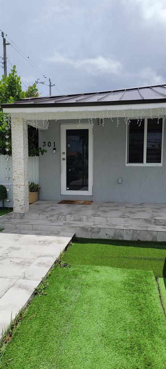 301 Southwest 36th Avenue Miami, FL 33135 - Photo 29 of 32 a front view of a house with a yard