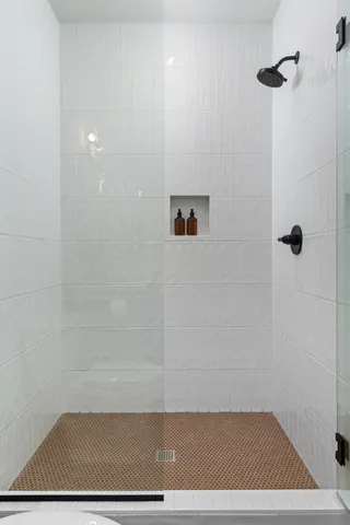 a view of bathroom with bathtub and shower