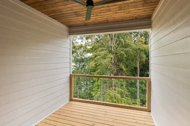 a view of a balcony with wooden floor