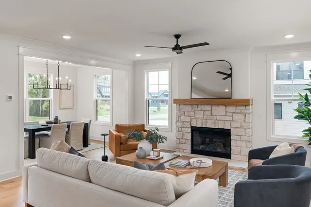 a living room with furniture and a fireplace