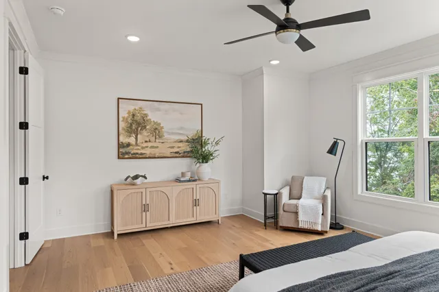 a living room with furniture a window and a rug