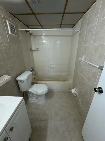 a view of a livingroom with a ceiling fan and a chandelier fan