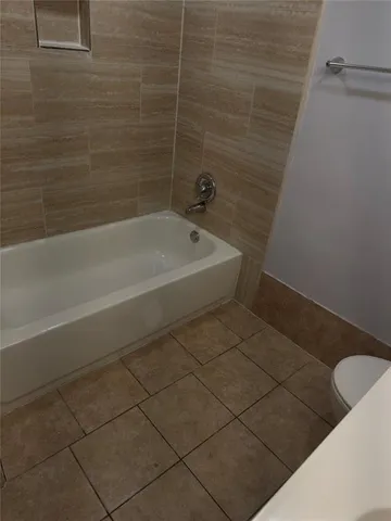 a view of backyard with trampoline